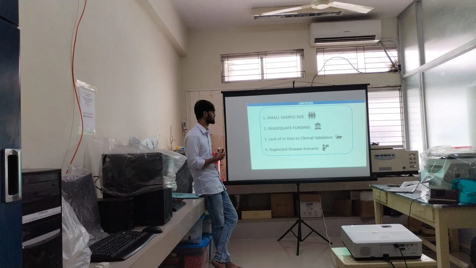 Presenting slides at a departmental seminar session.