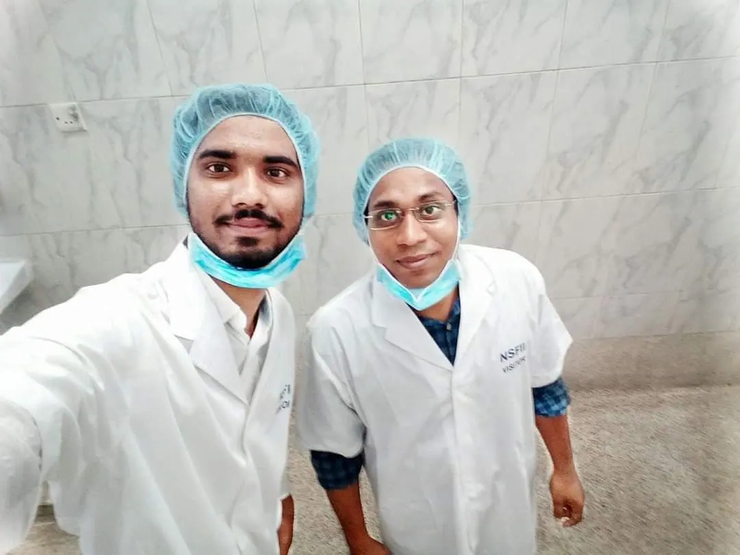 Gowned for the molecular biology suite during the National Institute of Biotechnology internship.